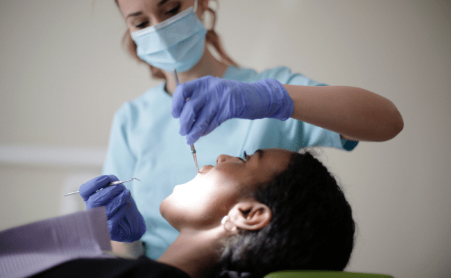 dental hygienist and patient