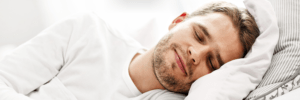 person enjoying a restful night of sleep without dry mouth
