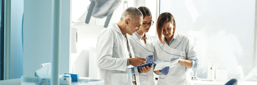 Dentists reviewing paperwork