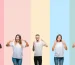 5 people smiling on pastel colors