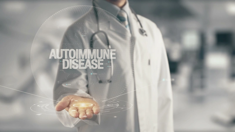 Doctor holding the word Autoimmune disease