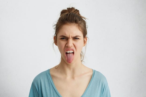 A woman with diabetes and dry mouth experiencing oral discomfort